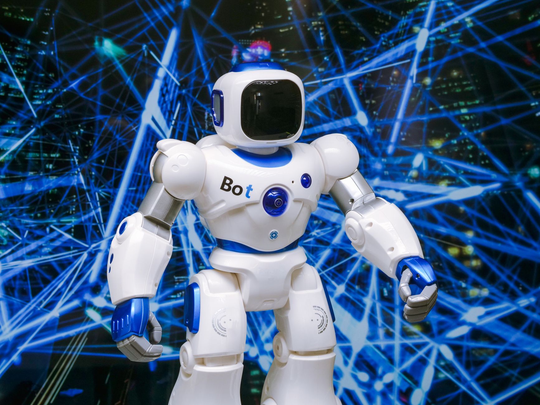 Advanced humanoid robot with glowing blue accents in a digital network setting